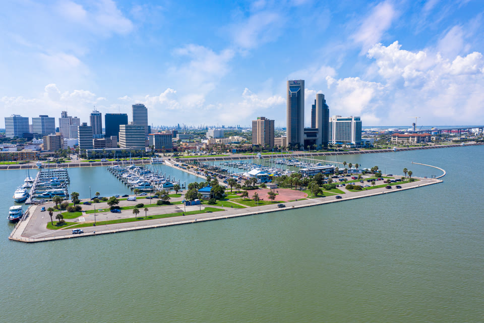 Corpus Christi skyline at day with the marina and boats along Ocean Drive