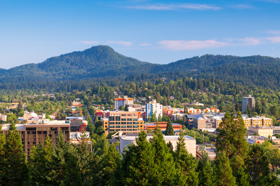 Eugene, Oregon downtown cityscape with mountains in the background