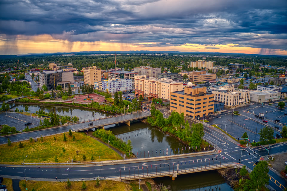 Aerial view of downtown Fairbanks, Alaska during a stormy summer sunset