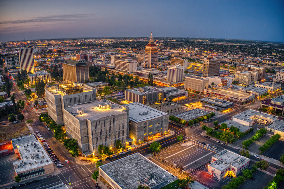 Downtown Fresno, California at dusk, with the historic Pacific Southwest Building lit up