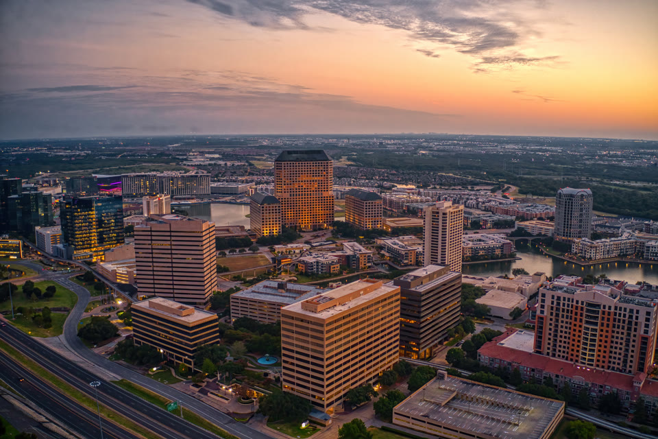 Aerial view of the Las Colinas skyline in Irving, Texas at sunrise