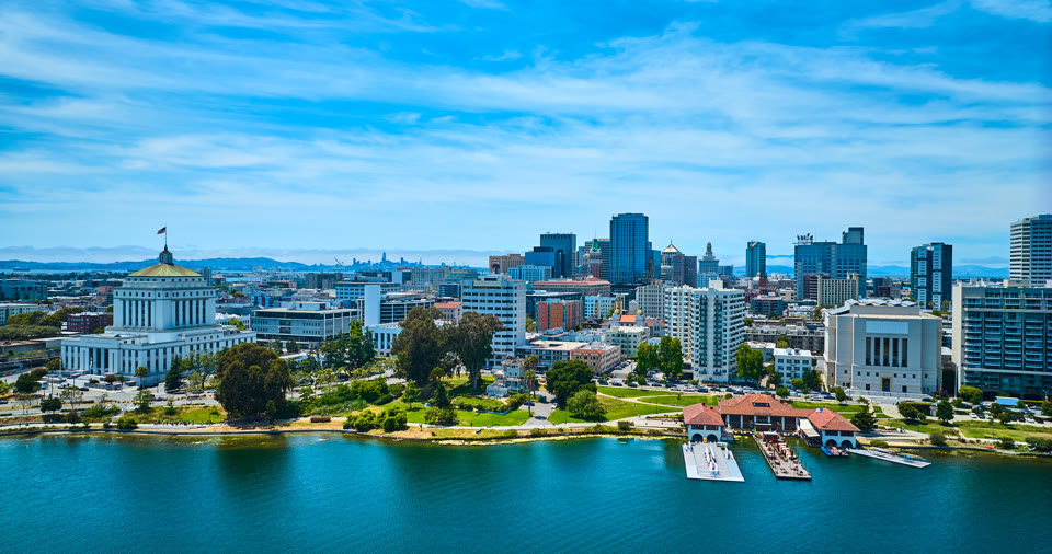 Low aerial of downtown Oakland skyscrapers and the courthouse