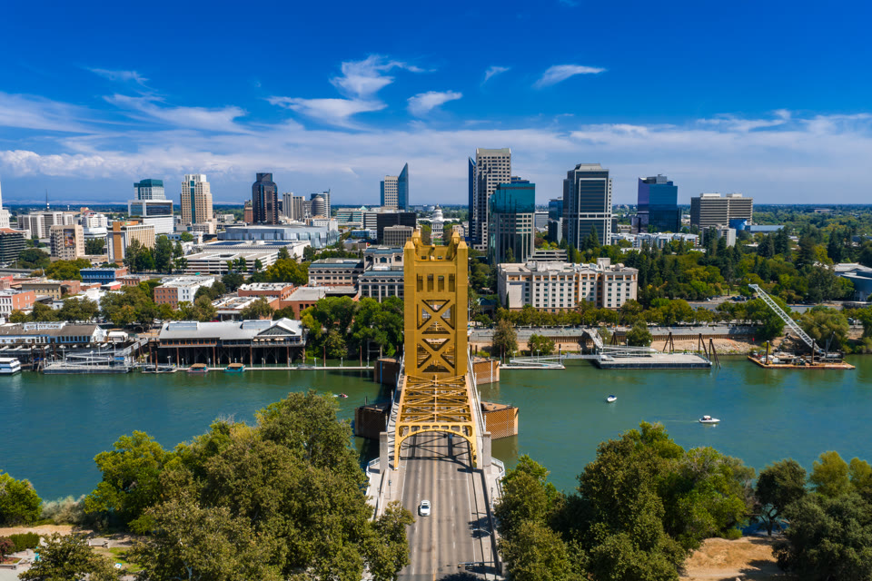 Sacramento's Tower Bridge with the downtown skyline and State Capitol behind it