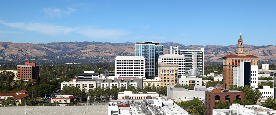 Panoramic view of downtown San Jose with City Hall and the Diablo Range hills in the background