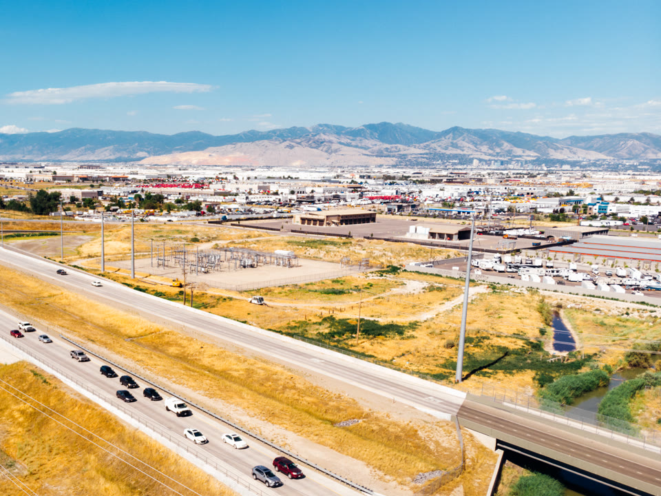 Mountain View Corridor passing through developed areas of West Valley City, Utah, with the Wasatch Mountains in the distance